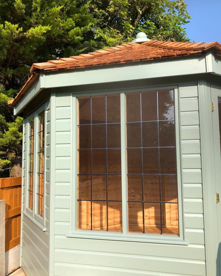 Close-up of the summerhouse leaded windows and cedar shingle roof