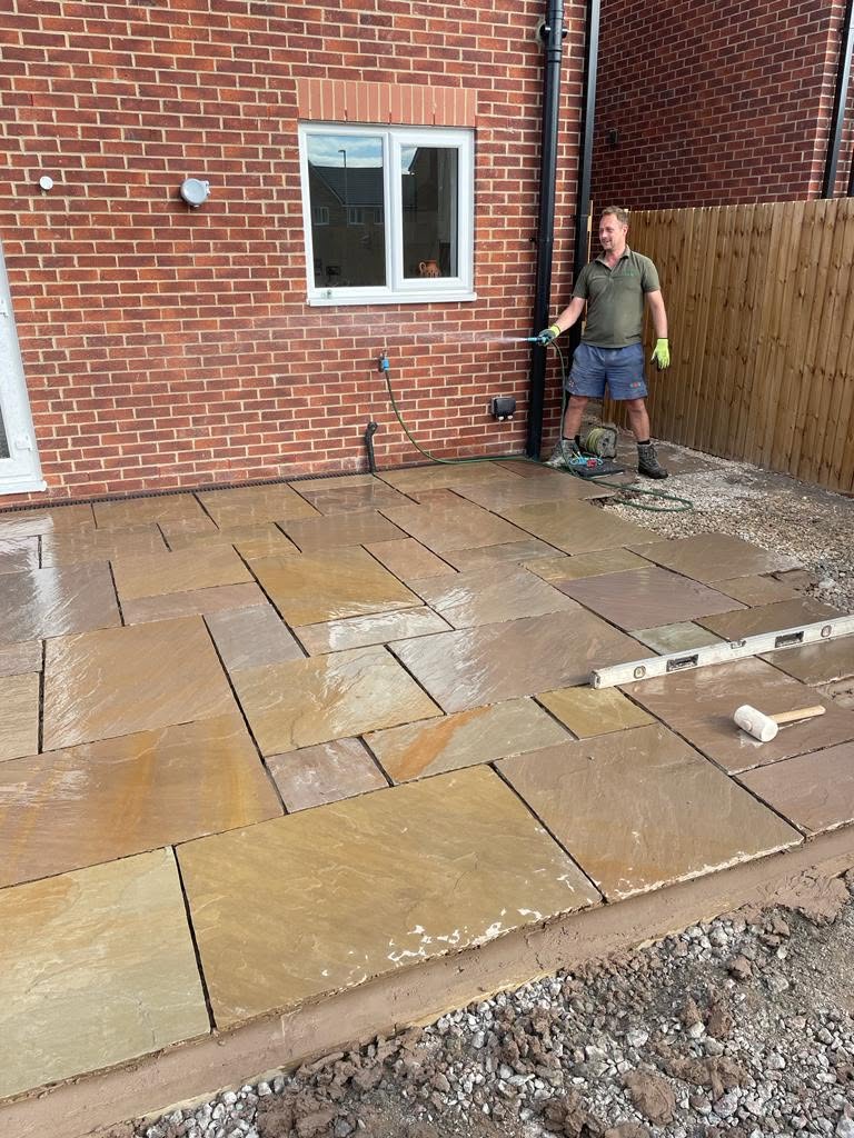 Croston Landscape Services laying an Indian sandstone patio