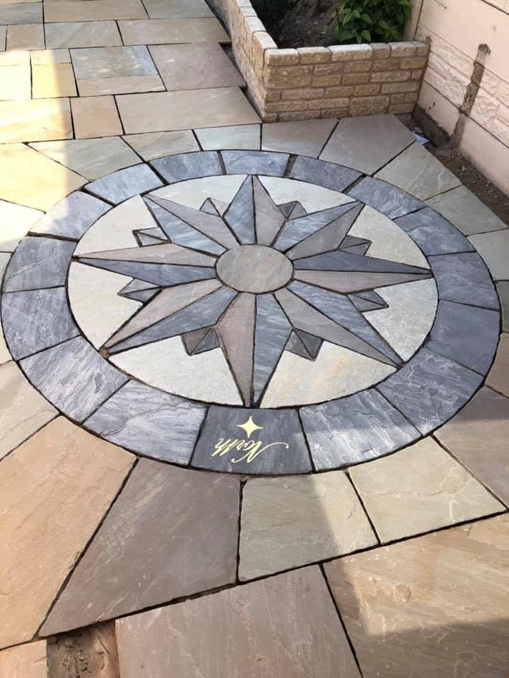 Bespoke sandstone compass rose medallion with Noel signature inlaid